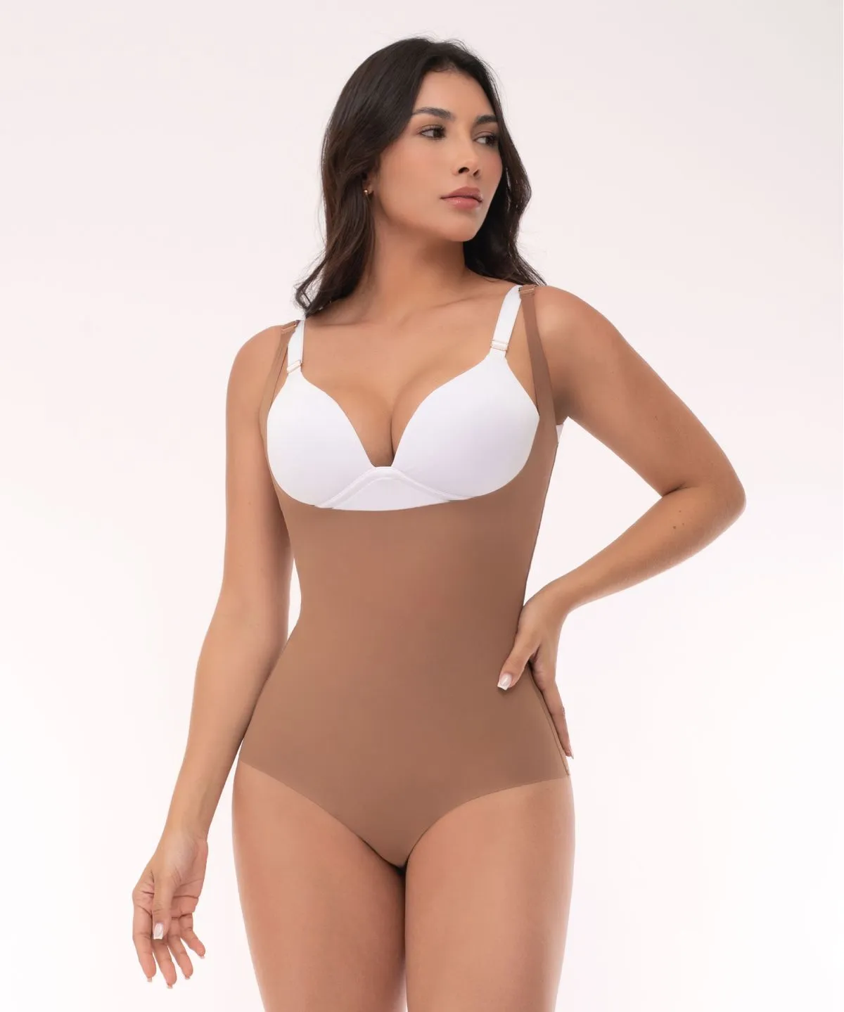 Seamless, open-bust, invisible bodysuit with even compression in the abdomen and waist.